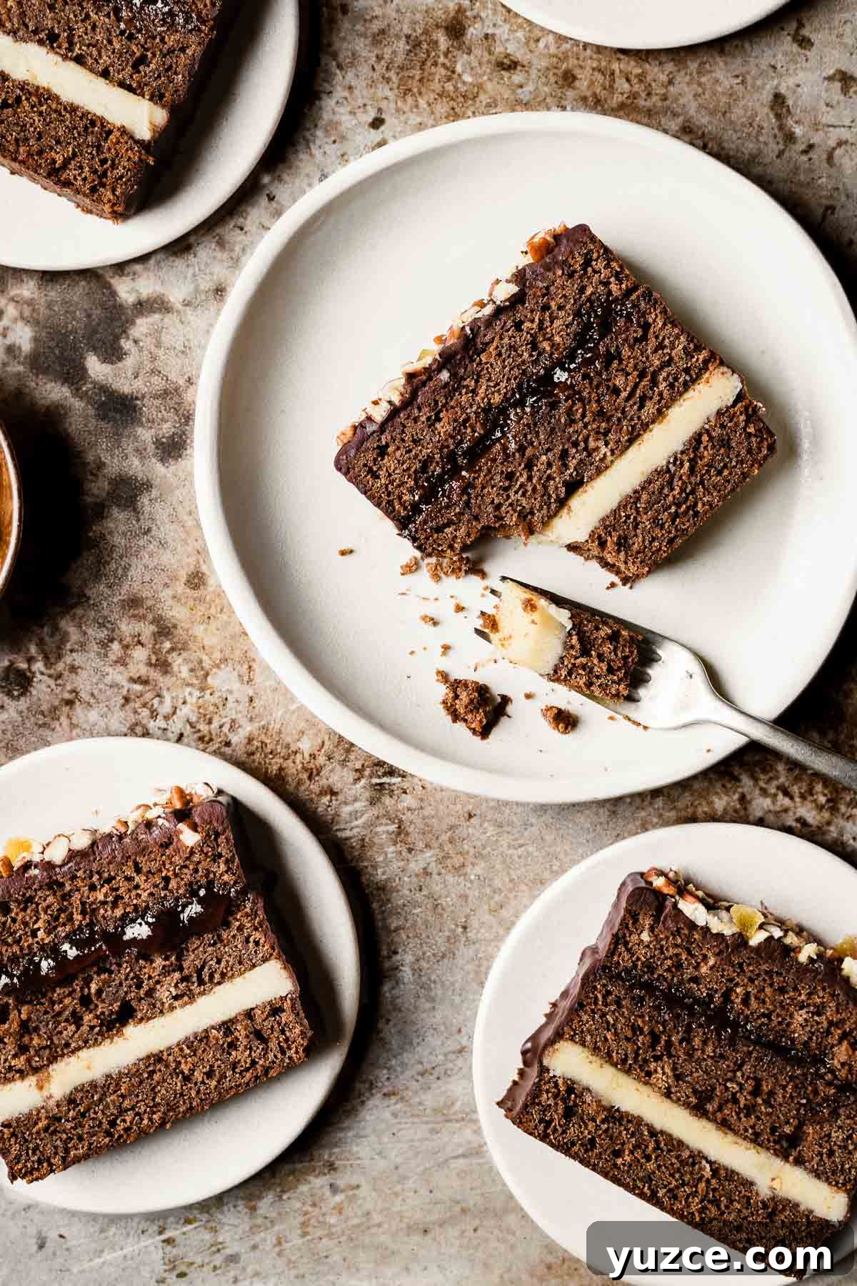 Traditional Polish Piernik Gingerbread Cake Recipe 10 Slices of piernik honey spice cake on tan plates.
