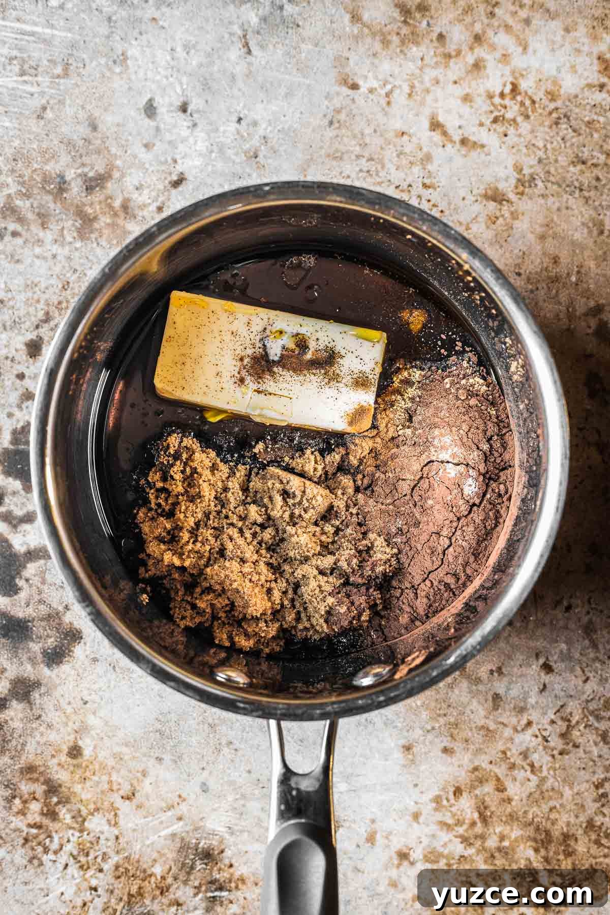 Traditional Polish Piernik Gingerbread Cake Recipe 5 A saucepan with butter, sugars and spices for gingerbread cake.