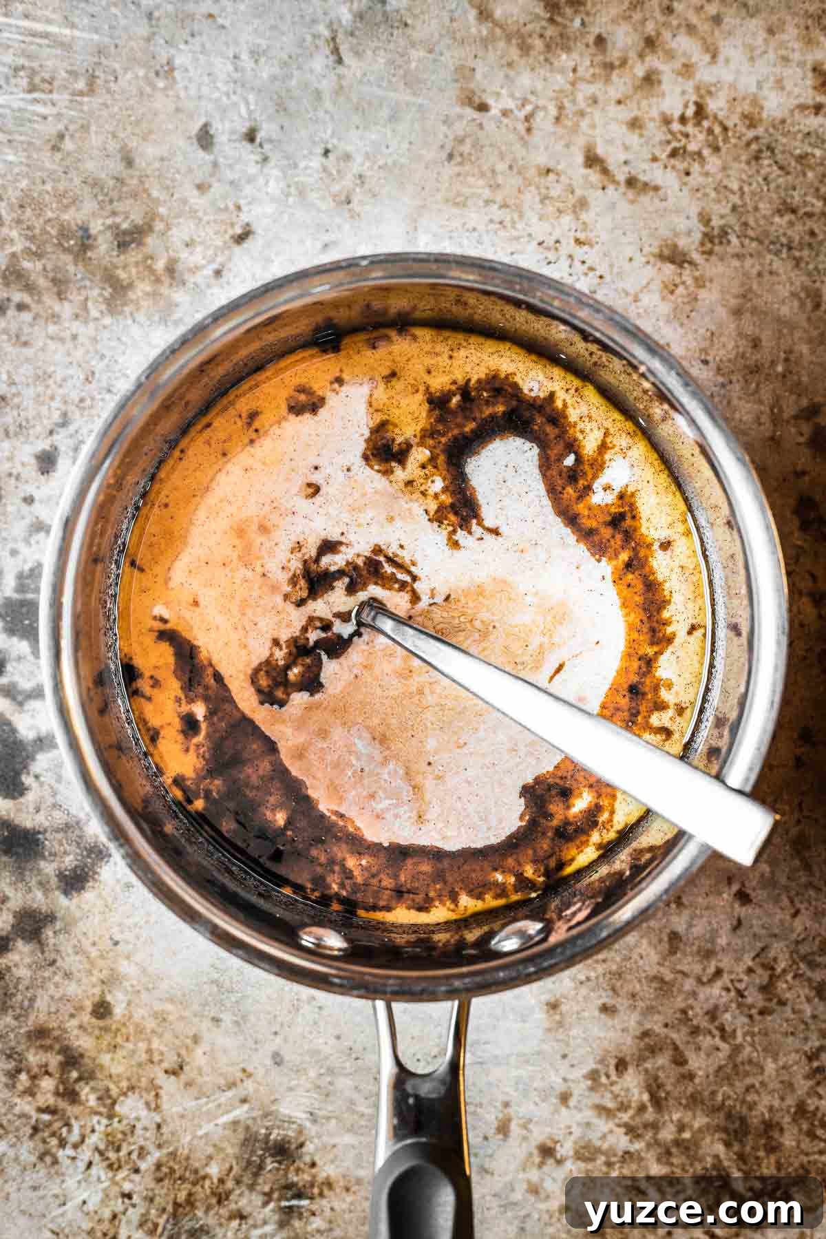 Traditional Polish Piernik Gingerbread Cake Recipe 6 A saucepan of cake batter with milk and vanilla added.