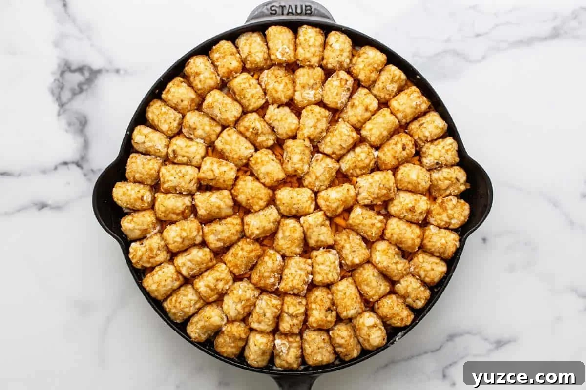 Frozen tater tots on top of a chicken casserole. 