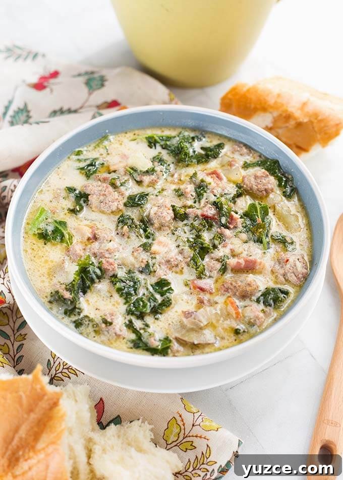 Crock Pot Zuppa Toscana: Italian Sausage and Potato Soup 3 Zuppa Toscana Sausage Potato Soup in a light blue bowl