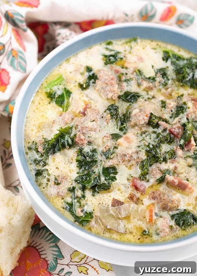 Crock Pot Zuppa Toscana: Italian Sausage and Potato Soup 4 Zuppa Toscana Sausage Potato Soup in a light blue bowl