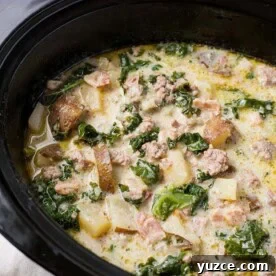 Zuppa Toscana Sausage Potato Soup in a black slow cooker