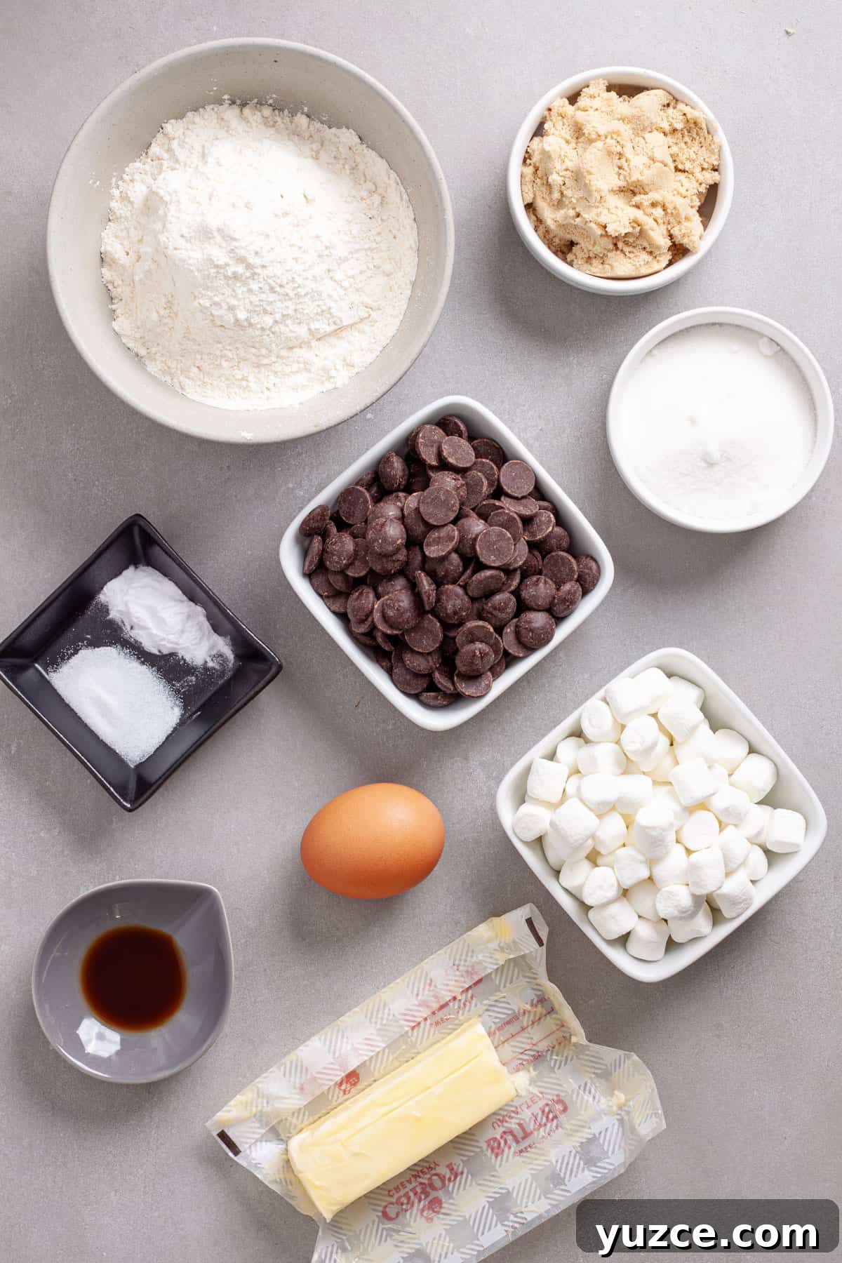 Chewy Chocolate Chip Cookies with Gooey Marshmallow Centers 3 Ingredients for chocolate chip marshmallow cookies on a gray table.