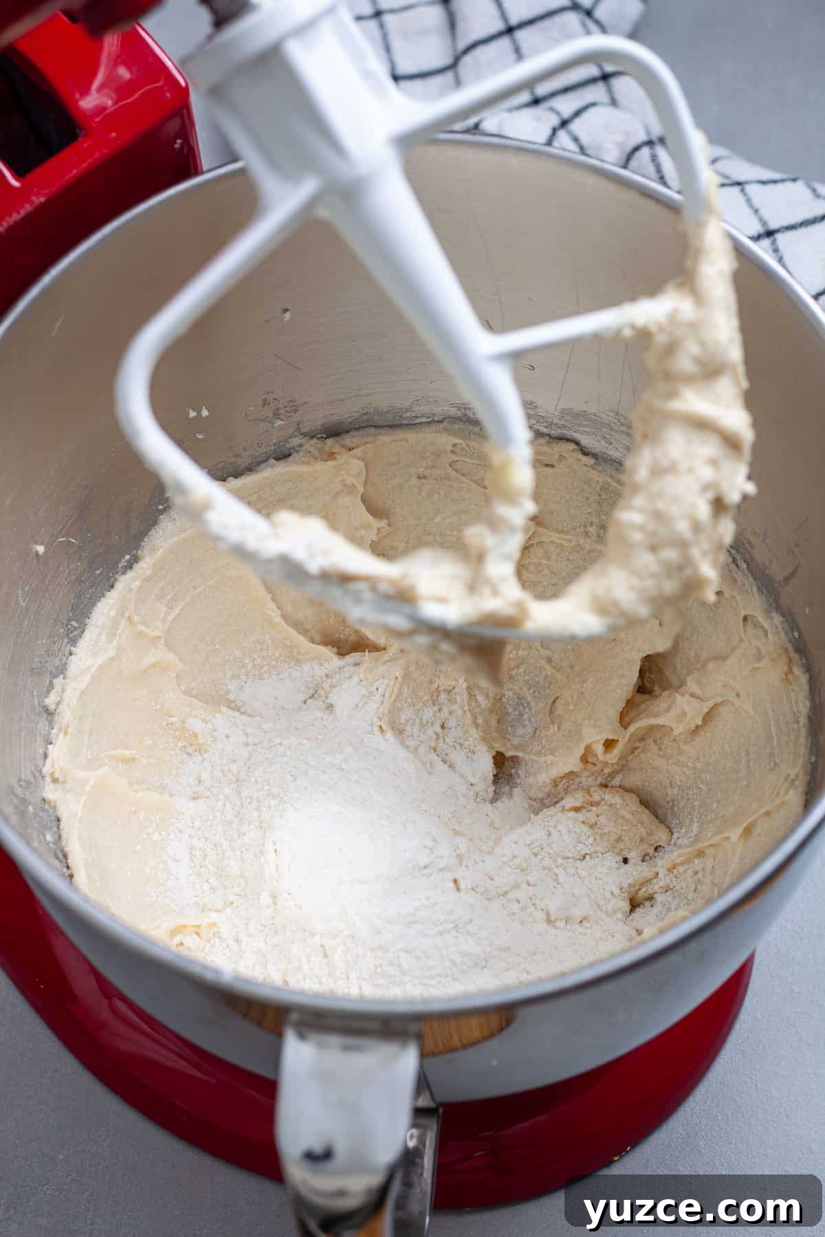 Chewy Chocolate Chip Cookies with Gooey Marshmallow Centers 8 Dry ingredients added to a stand mixer bowl with sugar, butter and eggs.