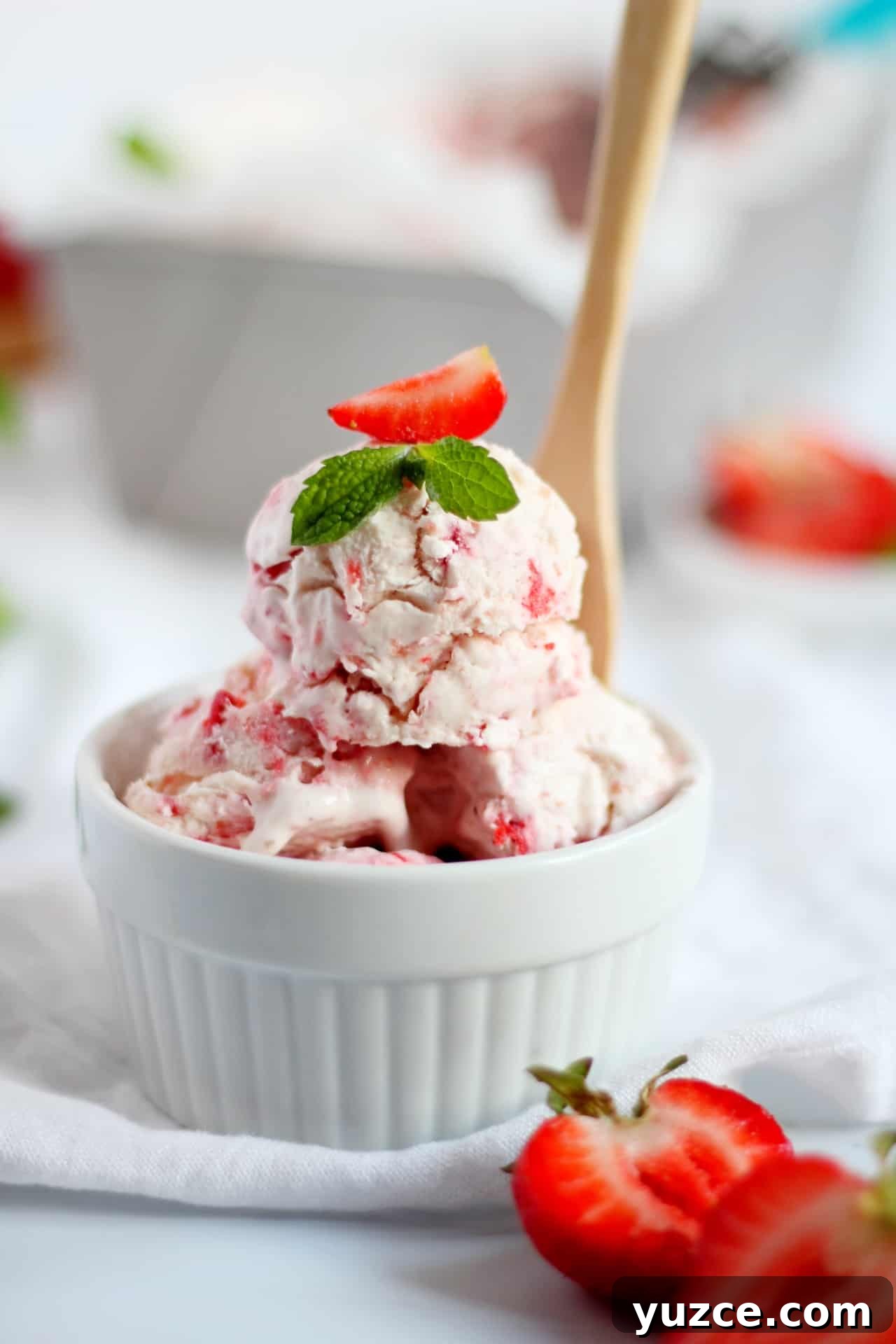 No-Churn Fresh Strawberry Ice Cream Recipe 5 close up of strawberry ice cream in white bowl