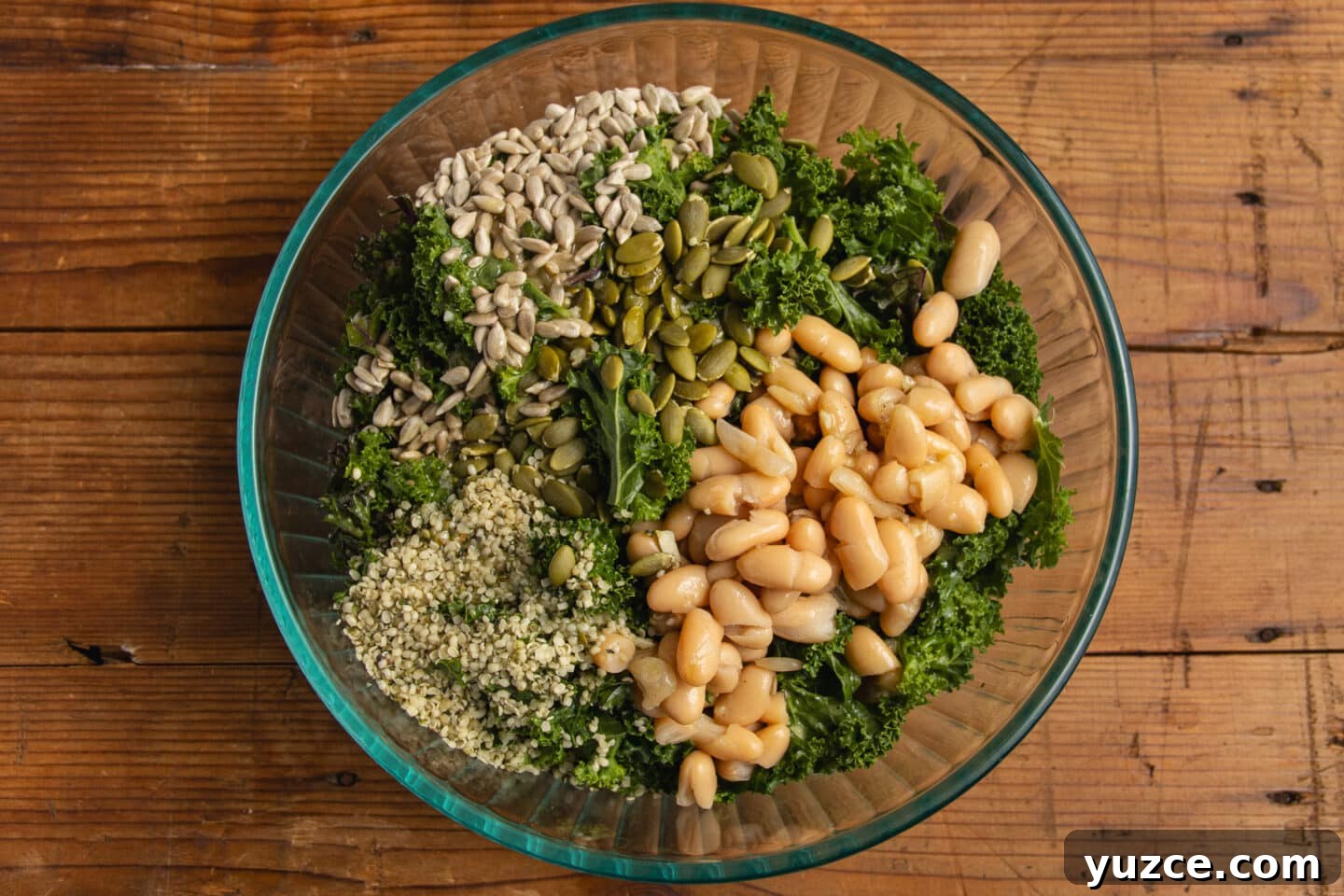 This is a picture of the salad being put together with the all the ingredients.
