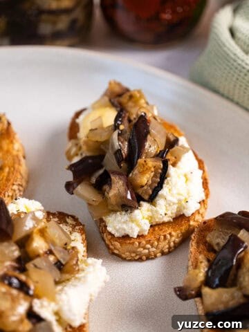 Marinated eggplant on toast with ricotta.