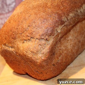Strawberry Lemon Flaxseed Quick Bread Recipe 4 A Strawberry lemon flax seed bread loaf on a wooden cutting board