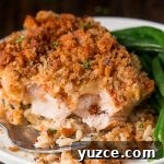 Chicken & Wild Rice Casserole is the ultimate comfort food layered with flavorful rice, chicken, a cheesy sauce, and crispy stuffing.