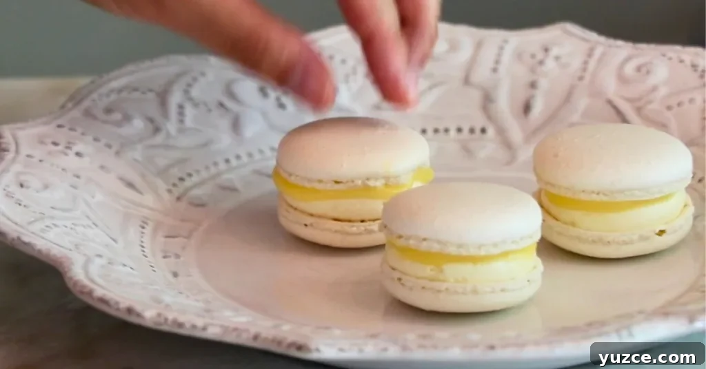 Luscious Lemon Buttercream Frosting Recipe for Cakes and Cupcakes 13 3 homemade lemon macarons with lemon curd and lemon buttercream