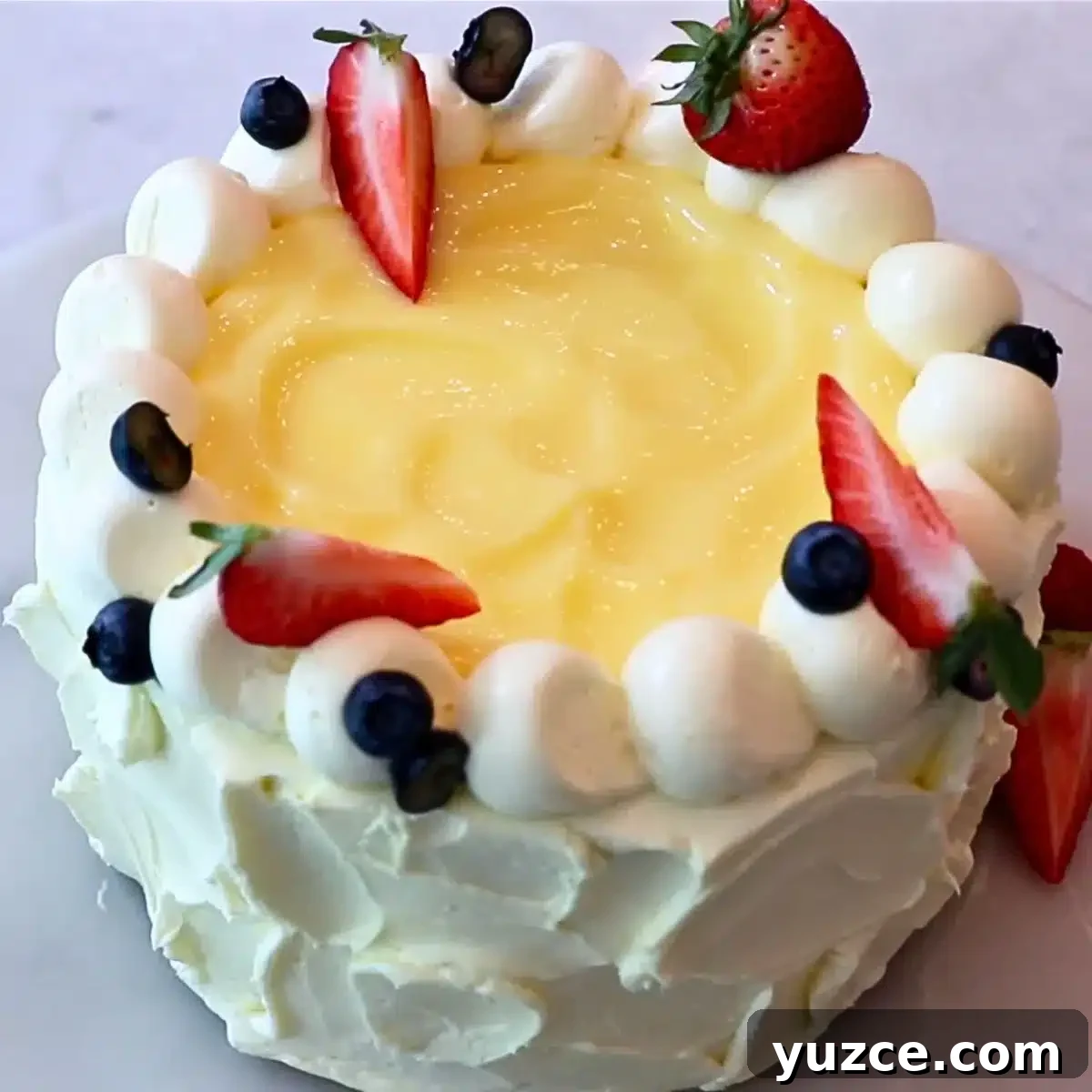 Luscious Lemon Buttercream Frosting Recipe for Cakes and Cupcakes 3 a whole lemon cake with lemon curd