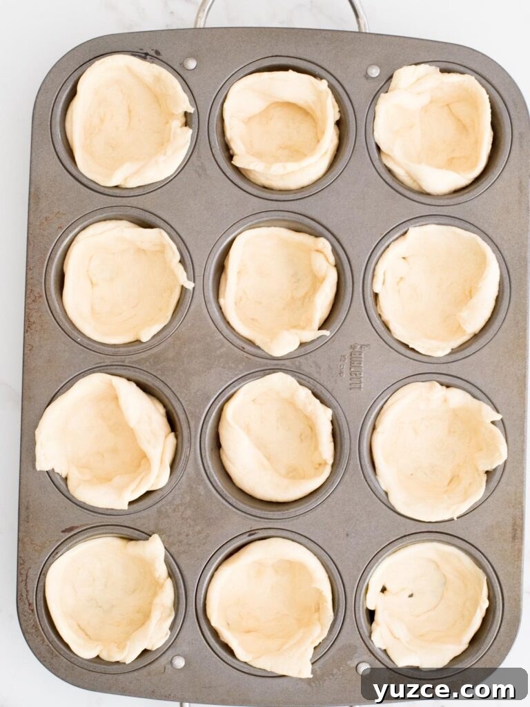 Mini Chicken Pot Pies Baked in Crescent Rolls 7 crescent roll dough in a muffin tin
