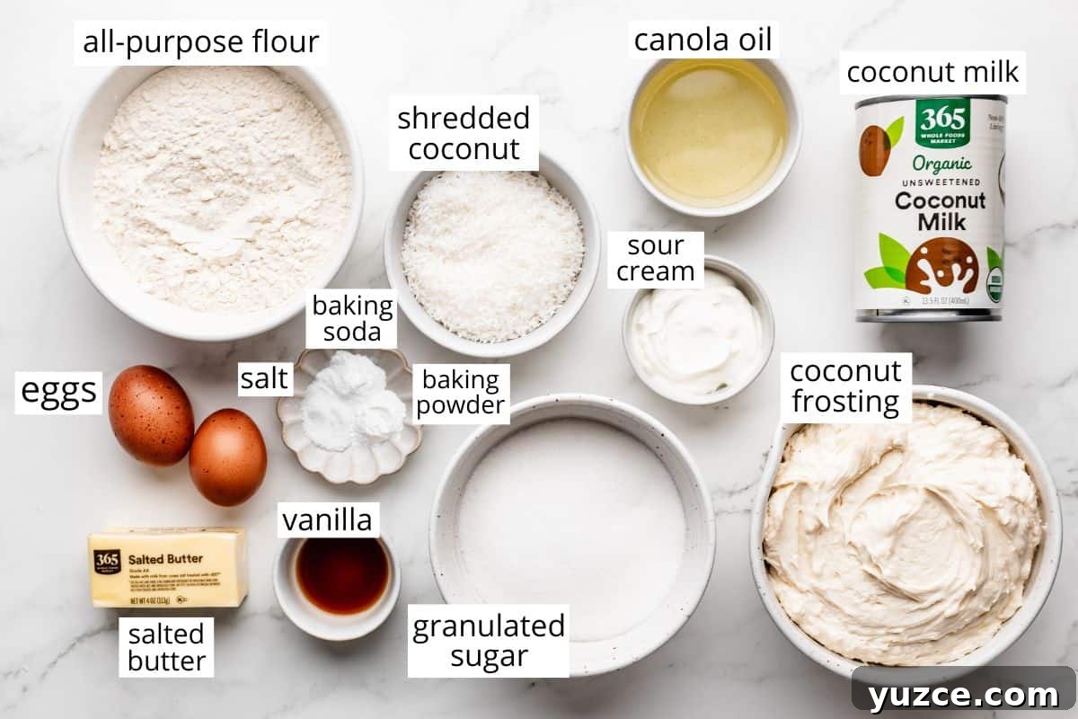 Moist Coconut Layer Cake Recipe 4 overhead photo of the labeled ingredients in this Coconut Cake recipe