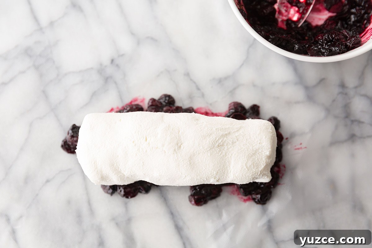 Creamy Goat Cheese Log with Blueberries and Honey 5 Making Blueberry Covered Goat Cheese Appetizer