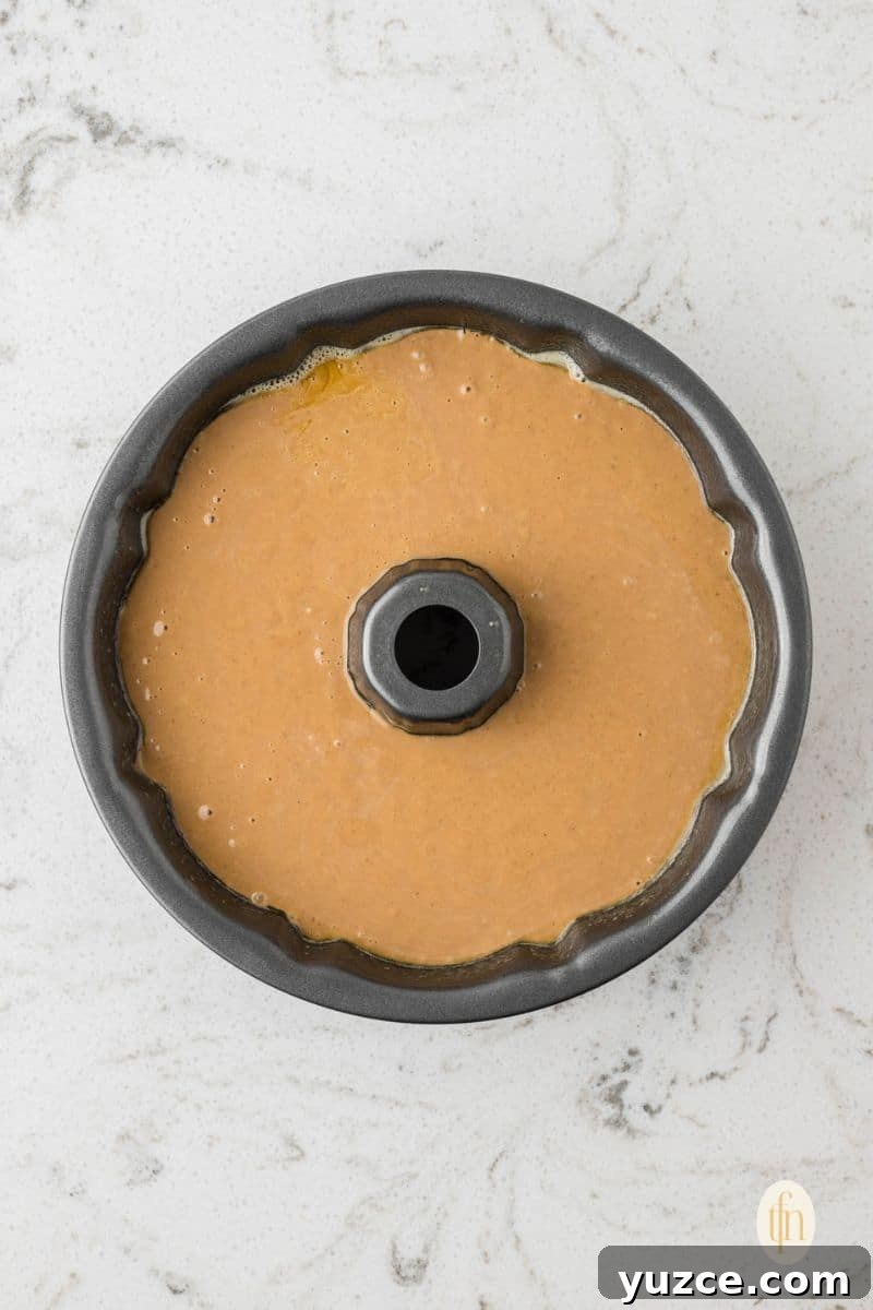 Batter mixture in a bundt cake pan.