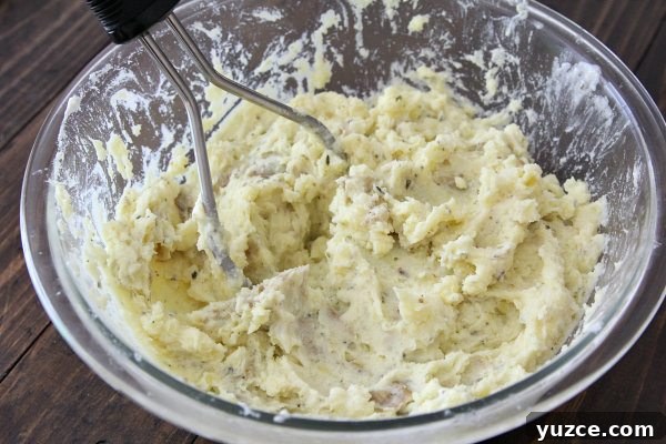 RICOTTA HERB MASHED POTATOES mashed potatoes in mixing bowl