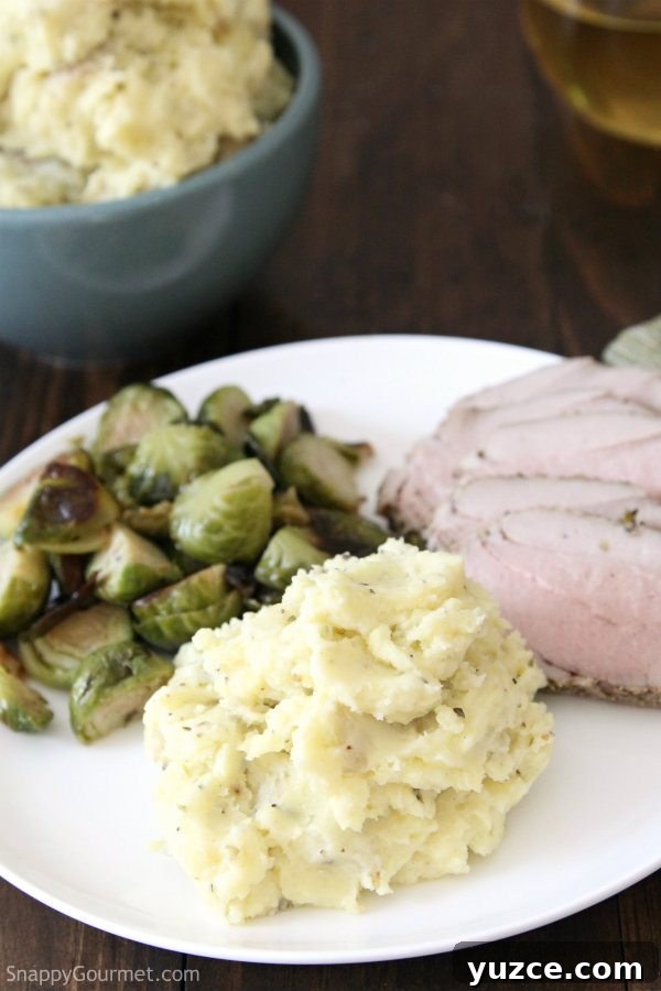 RICOTTA HERB MASHED POTATOES Ricotta Herb Mashed Potatoes on plate with meat and vegetables