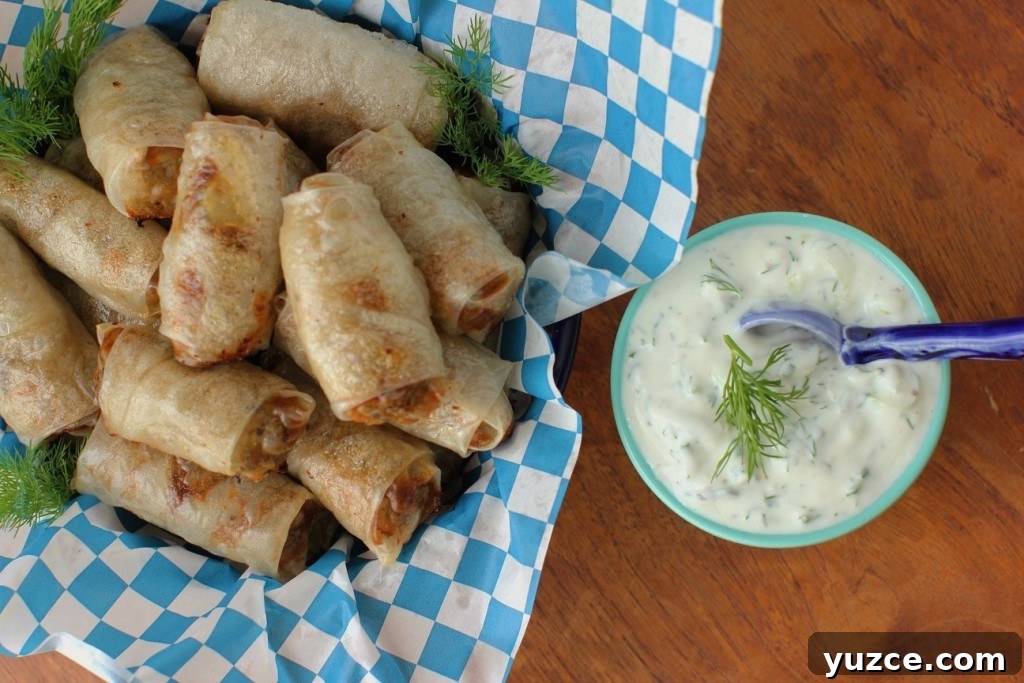 Gluten-Free Beef Sausage Rolls with Creamy Tzatziki Dip 14 baked gluten free sausage rolls and tzatziki sauce