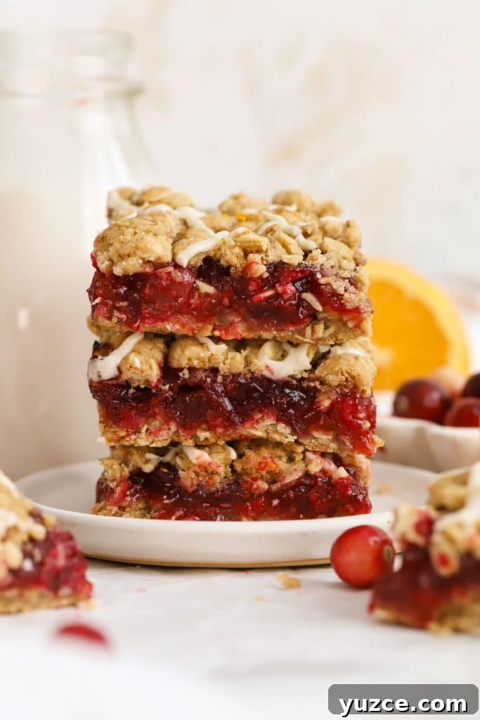 Sugared Cranberries Recipe: Simple Steps for Sparkling Cranberry Garnish 20 gluten-free cranberry crumble bars stacked on a white plate