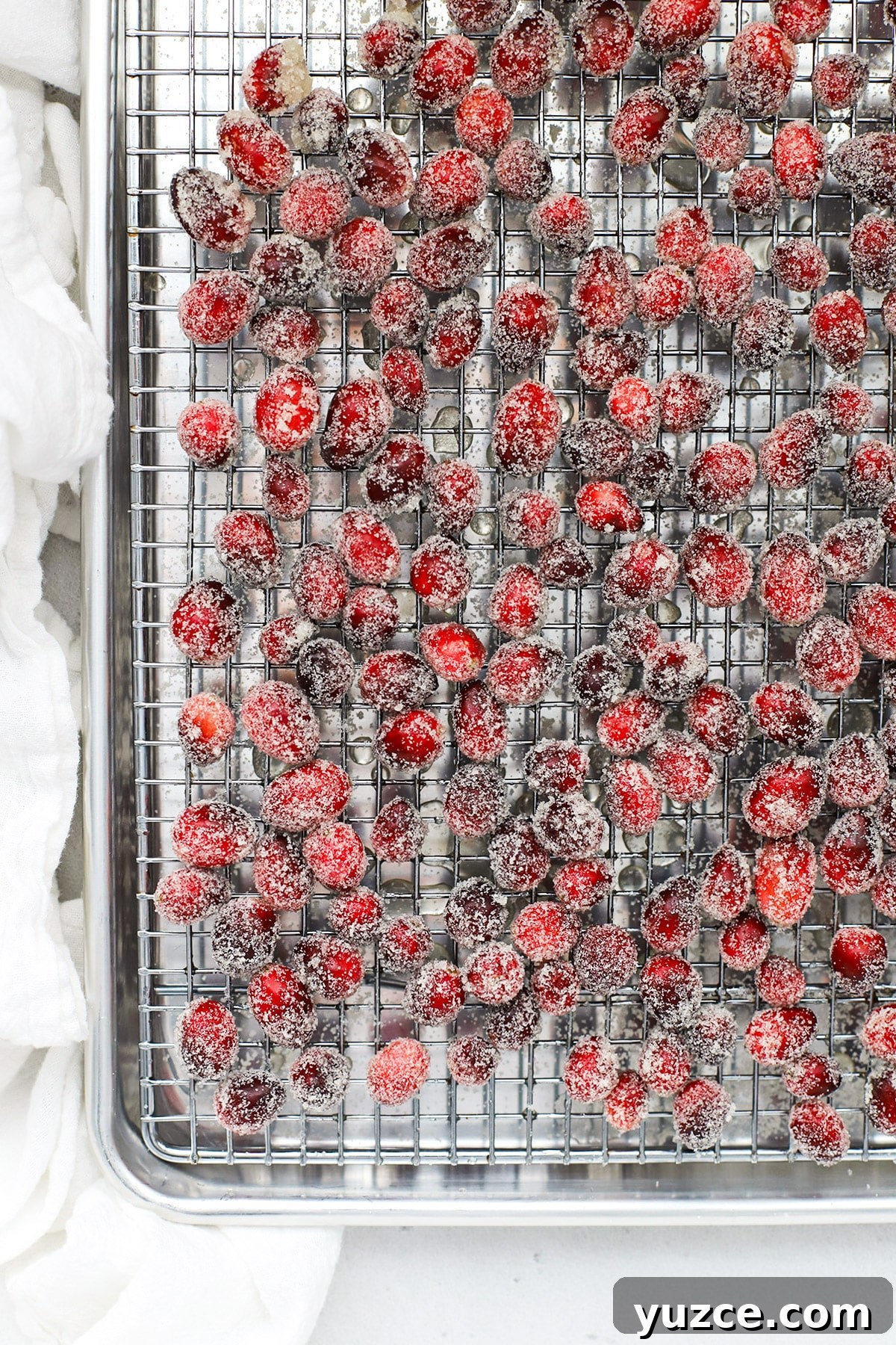 Sugared Cranberries Recipe: Simple Steps for Sparkling Cranberry Garnish 9 Sugar covered cranberries on a cooling rack