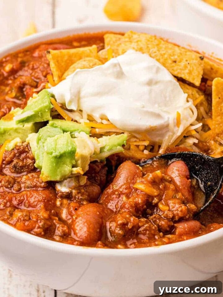 Hearty Dutch Oven Soup Recipes for Cozy Meals 20 close up of a bowl of venison chili with beans and sour cream on top