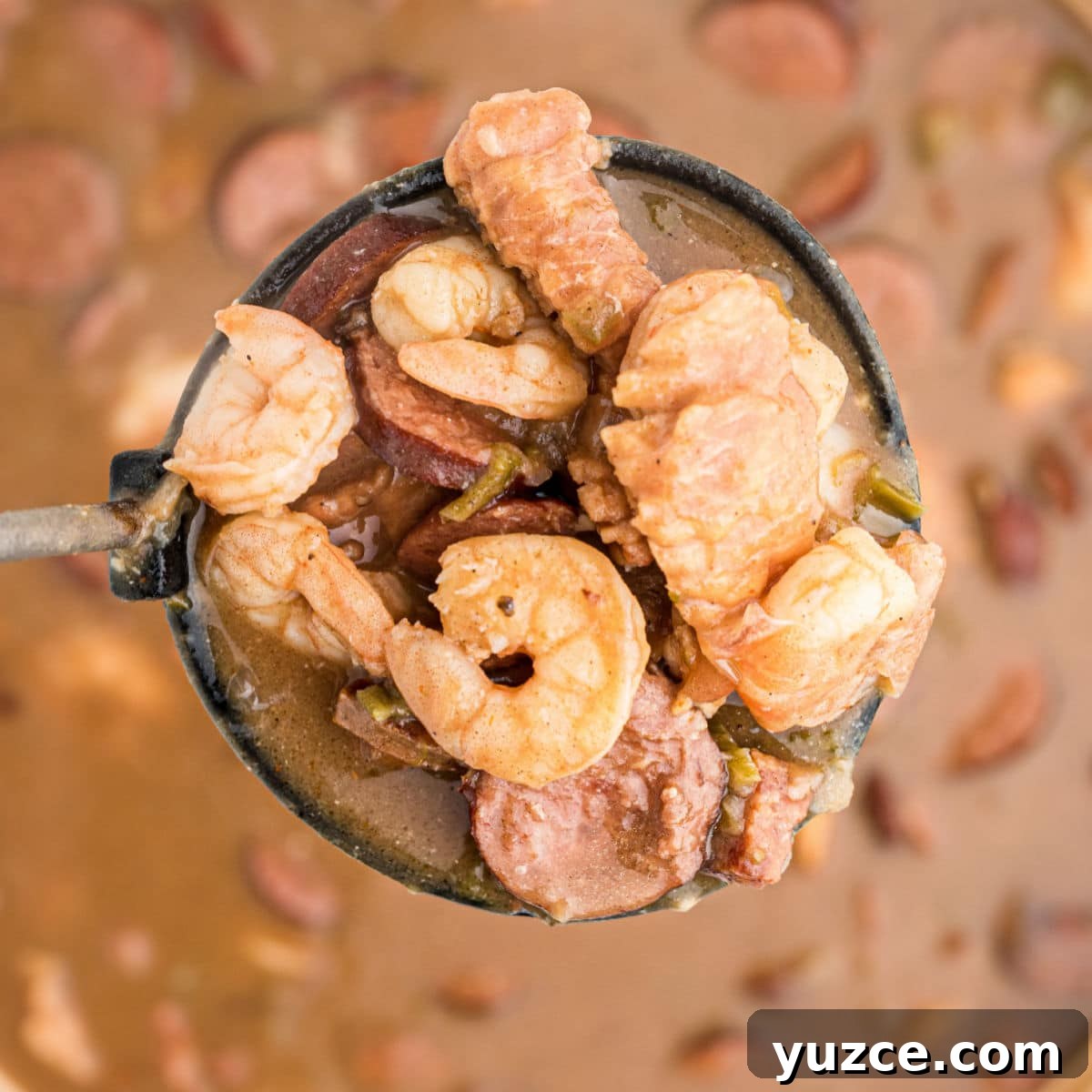 Hearty Dutch Oven Soup Recipes for Cozy Meals 9 a ladle full of alligator gumbo - with shrimp alligator and sausage
