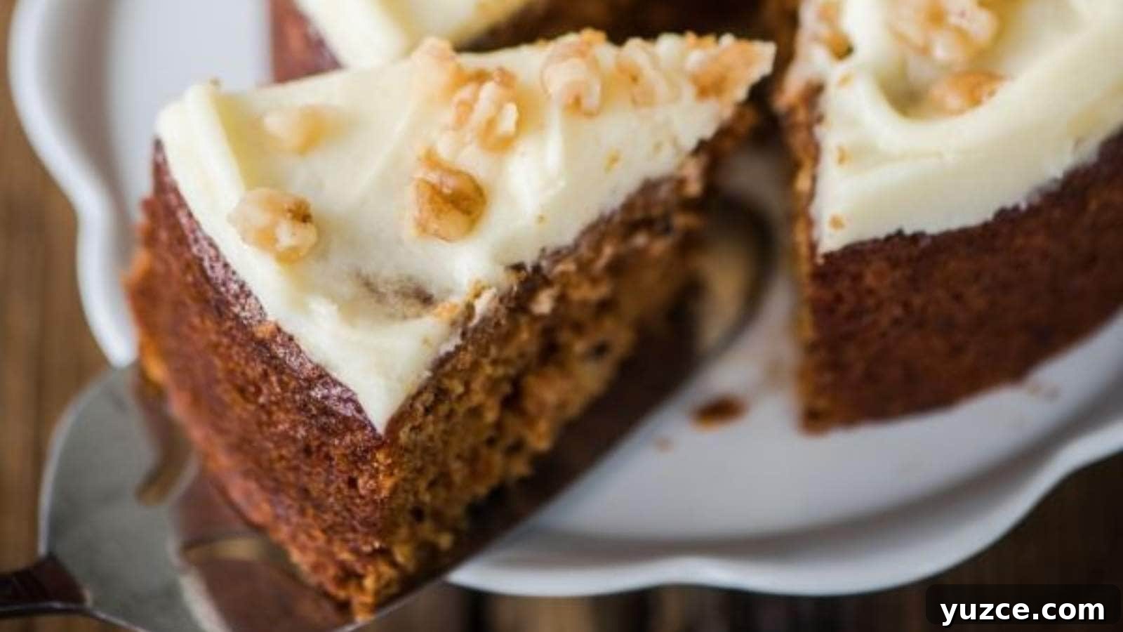 13 Sugar-Free Christmas Sweets That Still Feel Decadent 2 One piece of carrot cake being pulled away from the rest of the cake with a silver spatula.