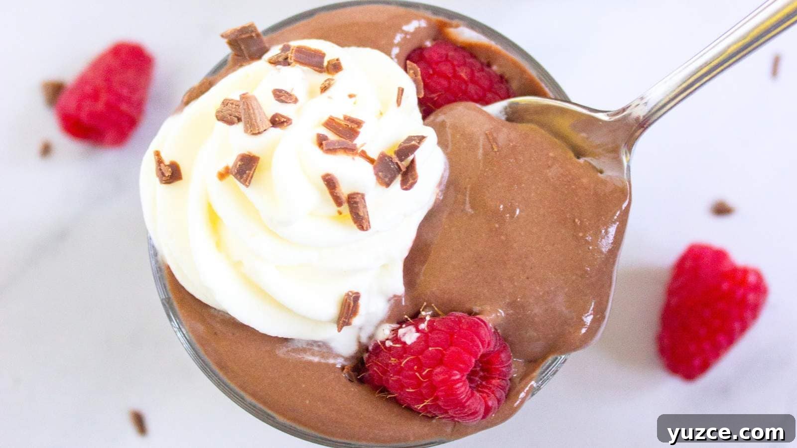 13 Sugar-Free Christmas Sweets That Still Feel Decadent 4 A glass cup filled with protein pudding topped with whipped cream.