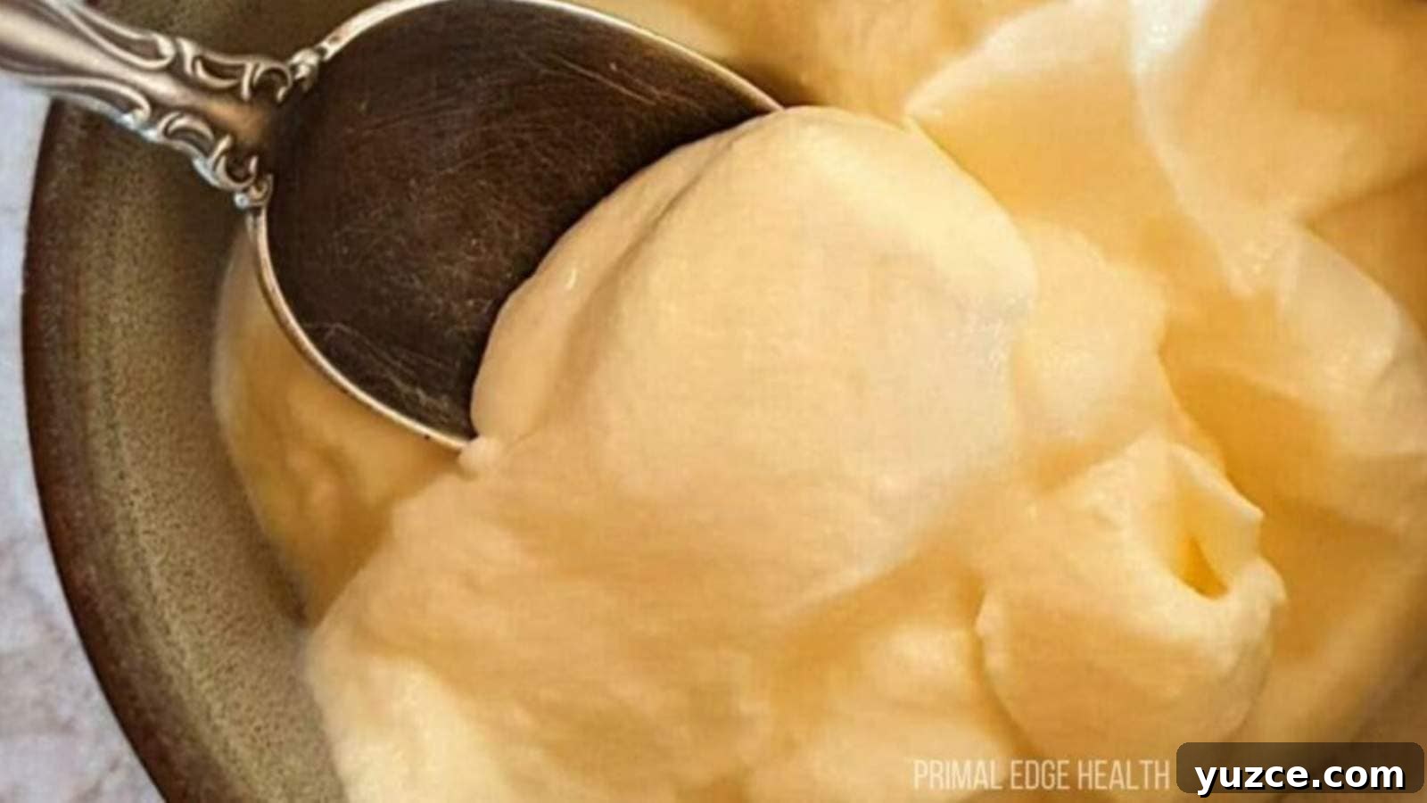 13 Sugar-Free Christmas Sweets That Still Feel Decadent 7 A spoon dipping into a bowl of cheesecake fluff.