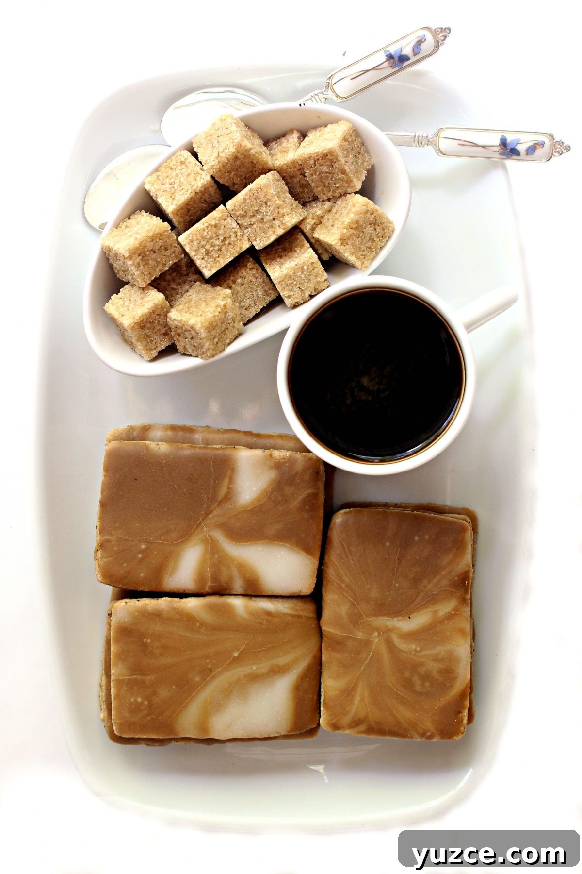 Crispy Coffee Cookies Recipe for Rich, Homemade Flavor 9 Coffee Cookies on a white platter with coffee and brown sugar cubes