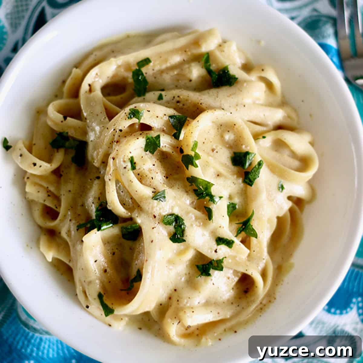 Perfect Wine Pairings for Popular Pasta Dishes 9 dairy free fettuccine alfredo topped with parsley.