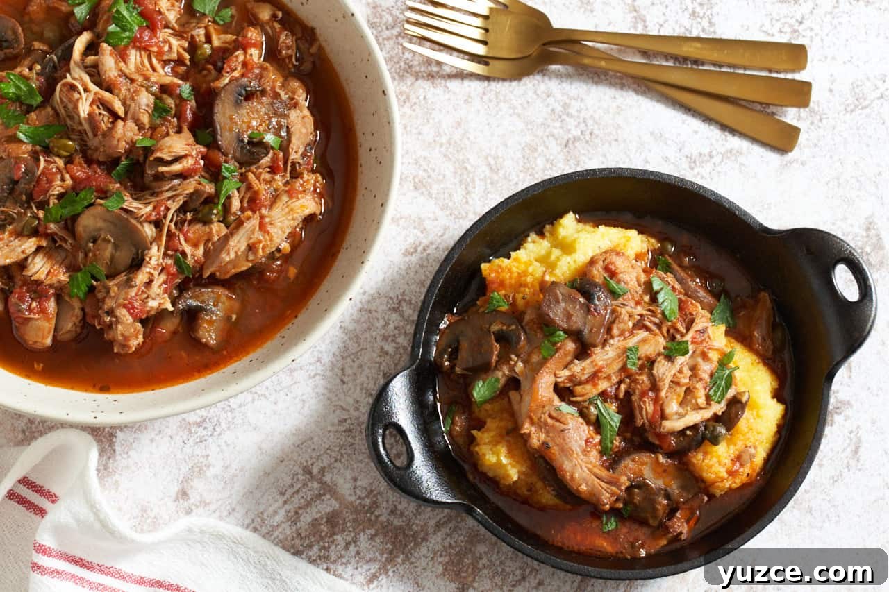 Slow Cooker Chicken Cacciatore Recipe for Tender, Flavorful Meals 2 A large serving bowl and a cast iron serving dish of slow cooker chicken cacciatore. Three gold forks are in the upper right, a red and white striped towel is in the lower left.