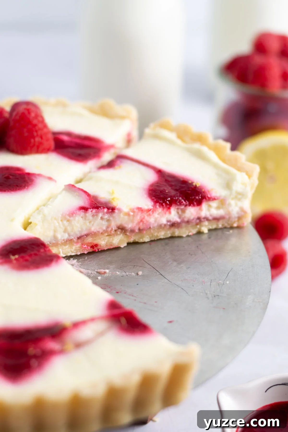 Lemon Raspberry Tart Recipe with a Buttery Shortcrust 3 slices of tart showing layers of shortbread crust, lemon filling and raspberry coulis topping